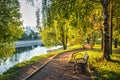 A bench in a park on the river bank and a temple in Vologda