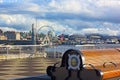 A bench at the Pier 66 with panorama of Puget Sound shore in Seattle, USA. Royalty Free Stock Photo