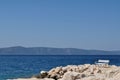 White bench in port. Podgora, Croatia Royalty Free Stock Photo