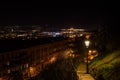 A bench on the promenade along the bank of the Moldava river at night, Prague, Czech Republic