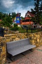 Bench and red-roofed buildings in Helen, Georgia. Royalty Free Stock Photo