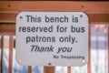 This bench is reserved for bus patrons only signage at downtown Tucson, Arizona Royalty Free Stock Photo