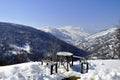 Bench for rest standing in snow. Royalty Free Stock Photo