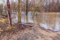 Bench on the river bank during the flood Royalty Free Stock Photo