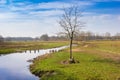 Bench at the riverbank of the Drentse Aa in Oudemolen Royalty Free Stock Photo