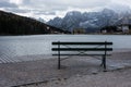 Bench with scenic alpine mountain lake view Royalty Free Stock Photo