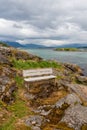 Bench by the sea bay in the fjord