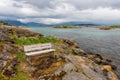 Bench by the sea bay in the fjord