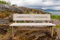 Bench by the sea bay in the fjord