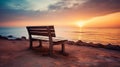 A bench sitting on top of a sandy beach Royalty Free Stock Photo