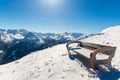 Bench in ski resort Bad Gastein in winter snowy mountains, Austria, Land Salzburg Royalty Free Stock Photo