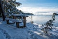 Bench and small table overlooking lake Vattern Motala Sweden