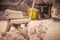 Bench with snow after snowstorm or in snow calamity in europe, winter night photograhy in city Royalty Free Stock Photo