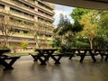 Bench with space in park view with building background