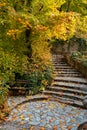 bench and stairs in beautiful colorful hanging garden of Palace in Lillafured Hungary autumn fall season in Bukk Royalty Free Stock Photo