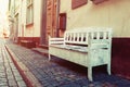 Bench on street in old city of Riga, Latvia Royalty Free Stock Photo