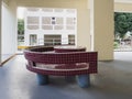 Bench and table at a HDB void deck area for public use in a residential neighbourhood