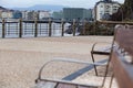 Bench to sit in promenade with metallic handrail