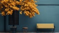 The bench is on a tree with fallen leaves. An empty park bench under an orange tree in the fall Royalty Free Stock Photo