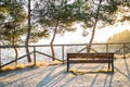 Bench and trees with views at the city over Barcelona during sunset Royalty Free Stock Photo