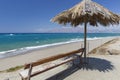 Bench and umbrella on Kommos beach, Crete, Greece Royalty Free Stock Photo