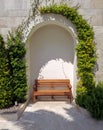 Bench under the arch in Tivat, Montenegro - Image Royalty Free Stock Photo