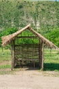 Bench under reed roof