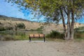 A bench facing Skaha Lake, Okanagan Fall, British-Columbia, Canada Royalty Free Stock Photo