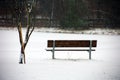 Bench under snow in Michigan cold winter lonely sad Royalty Free Stock Photo