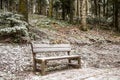 Bench under snow at park in winter time Royalty Free Stock Photo