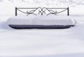 Bench under snowdrift Royalty Free Stock Photo