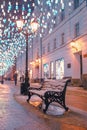 A bench under a street lamp. Stoleshnikov pereulok in Moscow.