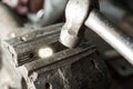 Bench vice with 1 euro coin and a hammer Royalty Free Stock Photo