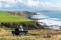 Bench with view of the cliffs on the north Cornish coast near Bude, England Royalty Free Stock Photo