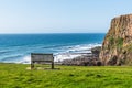 Bench with view of the cliffs on the north Cornish coast near Bude, England Royalty Free Stock Photo