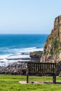 Bench with view of the cliffs on the north Cornish coast near Bude, England Royalty Free Stock Photo