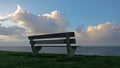 A bench with a view on clouds Royalty Free Stock Photo