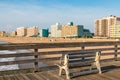 Bench on the Virginia Beach Oceanfront Fishing Pier at Daybreak Royalty Free Stock Photo