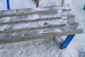 Bench in the winter city Park, covered with snow on a frosty winter day Royalty Free Stock Photo