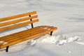 Bench in winter park on a background of snow, New Year Christmas. Royalty Free Stock Photo