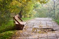 The bench of the wooden pallet stands on the alley of the park Royalty Free Stock Photo