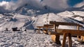 Benches on the background of a mountain with a cloud