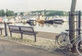 Benches, bicycles and boats on the embankment of Jyvaskyla, Finl Royalty Free Stock Photo