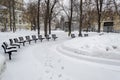 Benches and Chairs on Snow in Winter Park Royalty Free Stock Photo