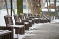 Benches covered with snow in winter park Royalty Free Stock Photo