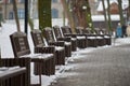 Benches covered with snow in winter park Royalty Free Stock Photo