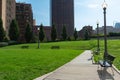 Benches and Light Posts at a Park in Downtown Chicago surrounded by Skyscrapers Royalty Free Stock Photo