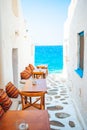 Typical Greek bar in Mykonos town with sea view, Cyclades islands, Greece Royalty Free Stock Photo