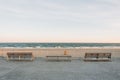Benches on the Rockaways Boardwalk and view of the beach, in Queens, New York City Royalty Free Stock Photo