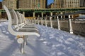 The benches, the snow, the river, the highway and the skyscrapers Royalty Free Stock Photo